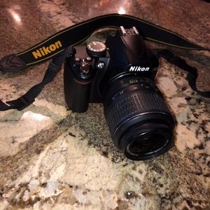 Nikon D3000 with detachable 18-55mm Nikon Lens.